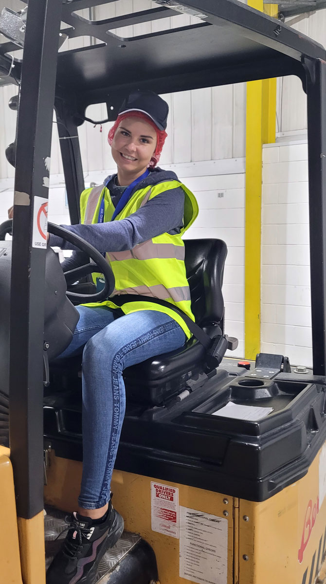 SGL Co-packing's Diana driving a forklift truck in the warehouse