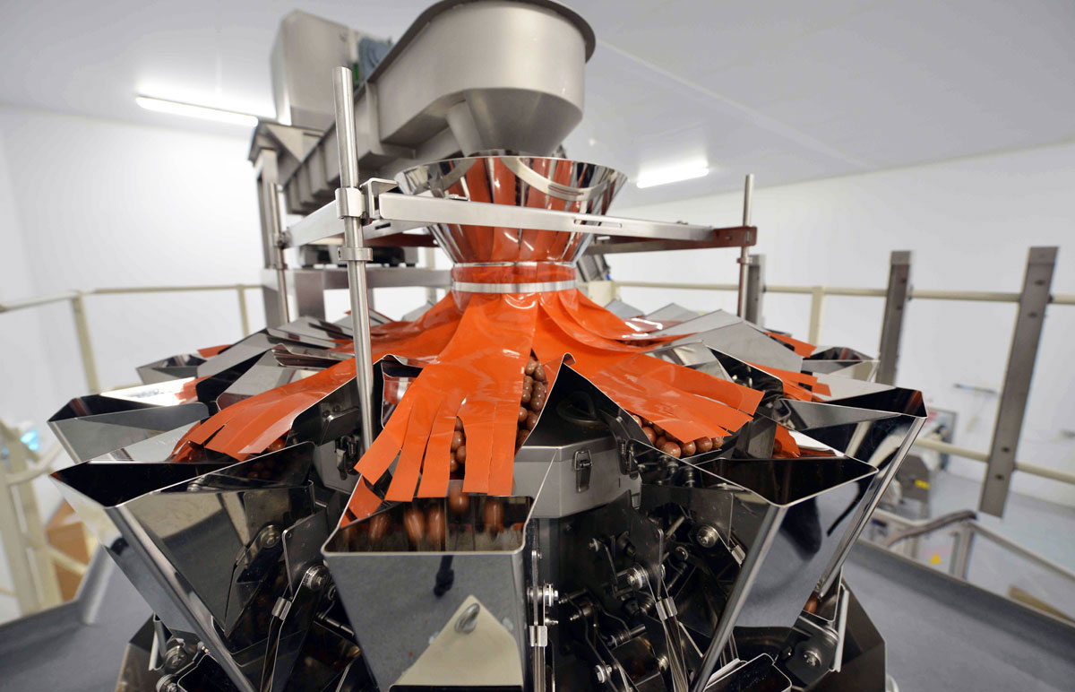 Photo: Multi-head weighing system used in the automatic bagging and sealing of food products at SGL Co-packing