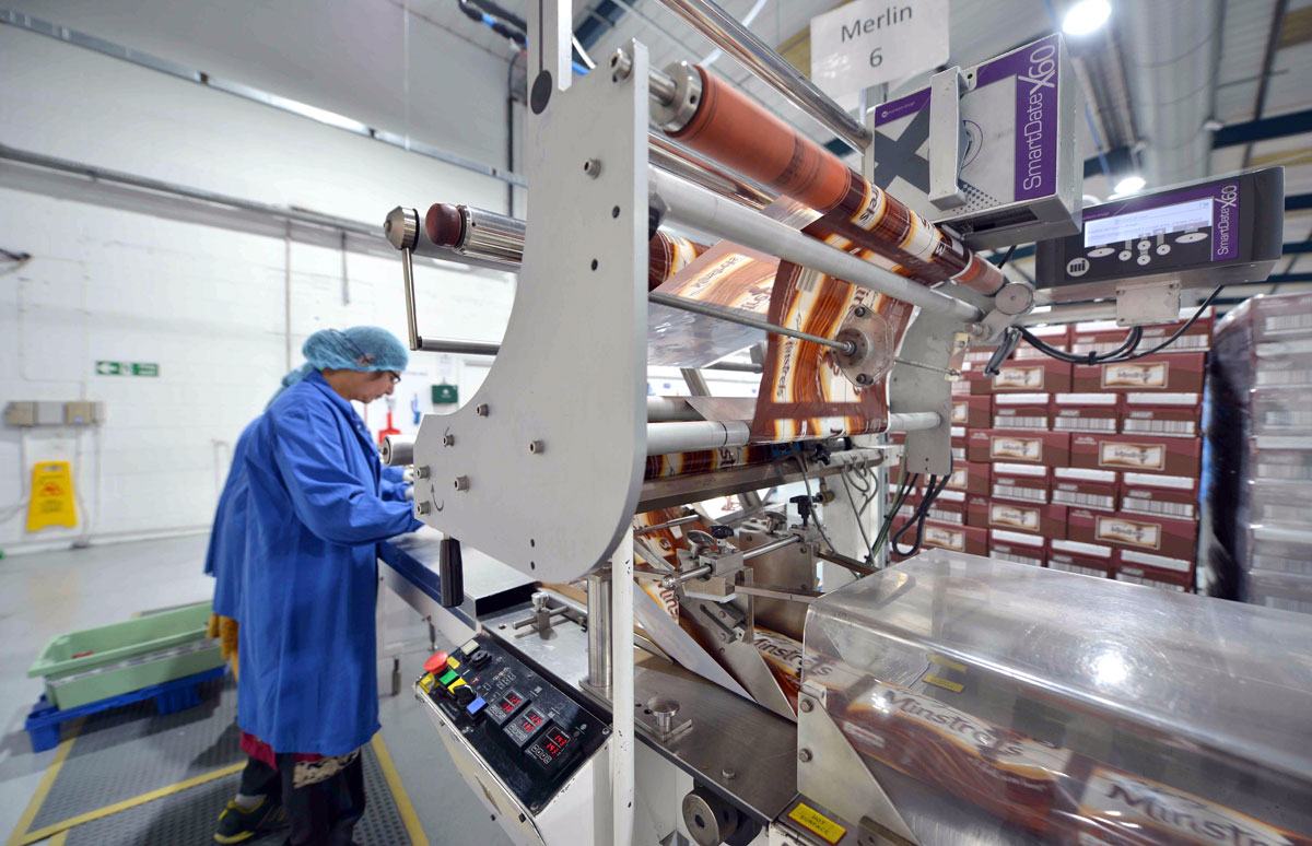 Photo: Workers inspecting confectionery after flow-wrapping at SGL Co-packing factory